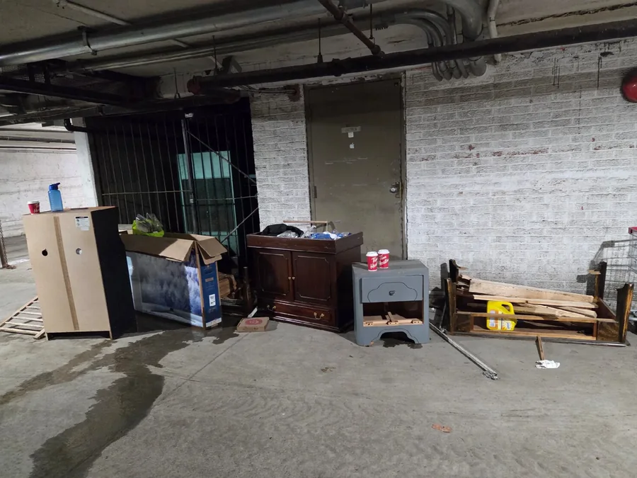 Furniture and debris left in a parking garage