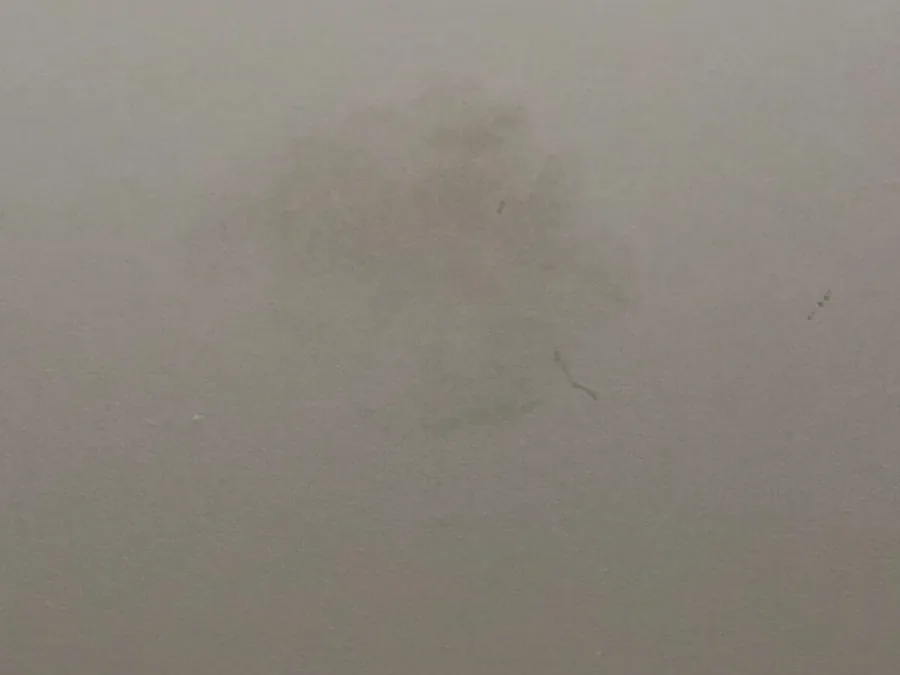 Discoloured spot on a kitchen ceiling, a possible sign of water getting in