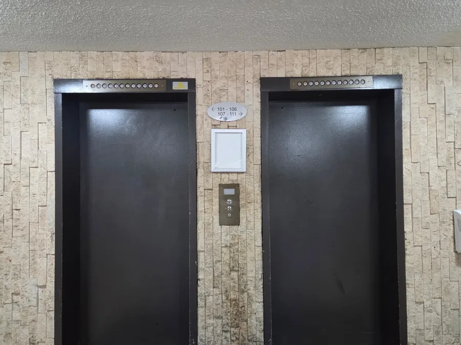 Elevators in a building, one out of service for over a year